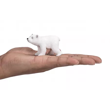 Figura de juguete de cachorro de oso polar caminando, esculpida y pintada a mano con realismo.