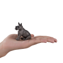 Figura de juguete realista de bebé rinoceronte blanco de la fauna africana.
